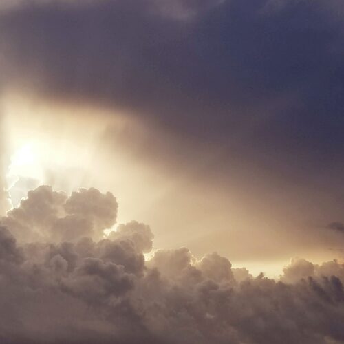 Sun breaking through clouds