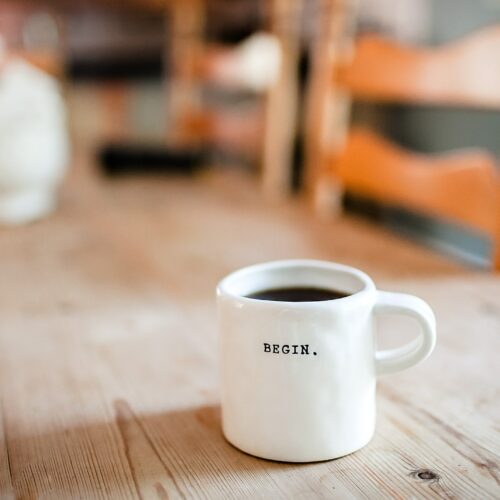 Coffee cup labelled 'Begin'
